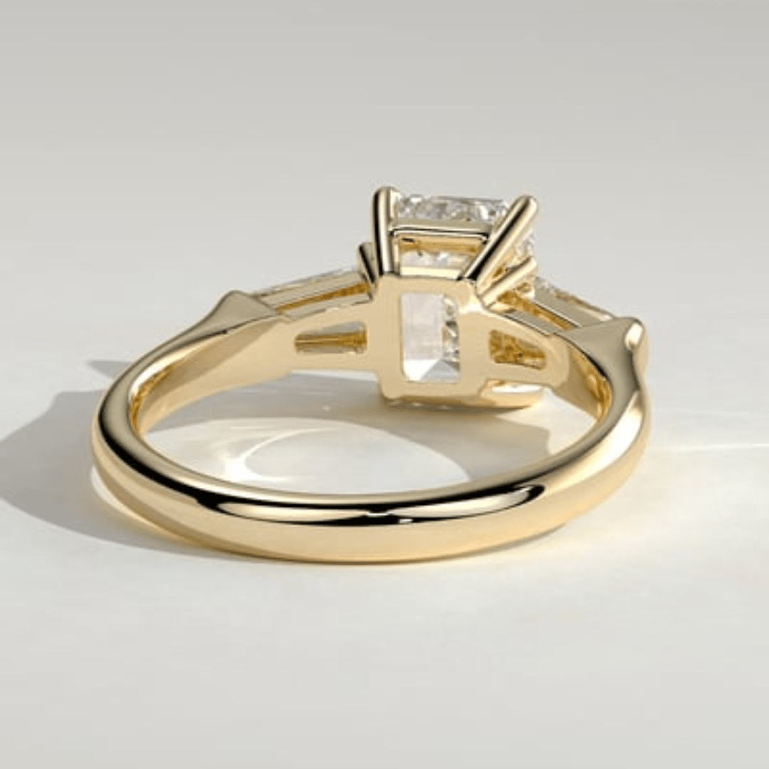 3 CT Emerald Cut Moissanite 4 Claw Trilogy with Tapered Baguette Side Stones Engagement Ring - Kazara Diam