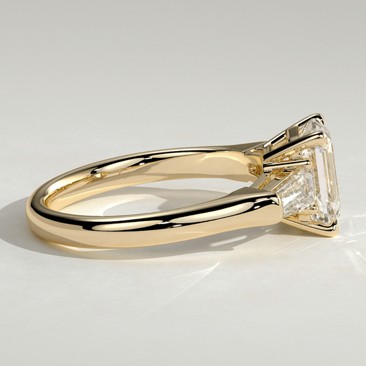 3 CT Emerald Cut Moissanite 4 Claw Trilogy with Tapered Baguette Side Stones Engagement Ring - Kazara Diam