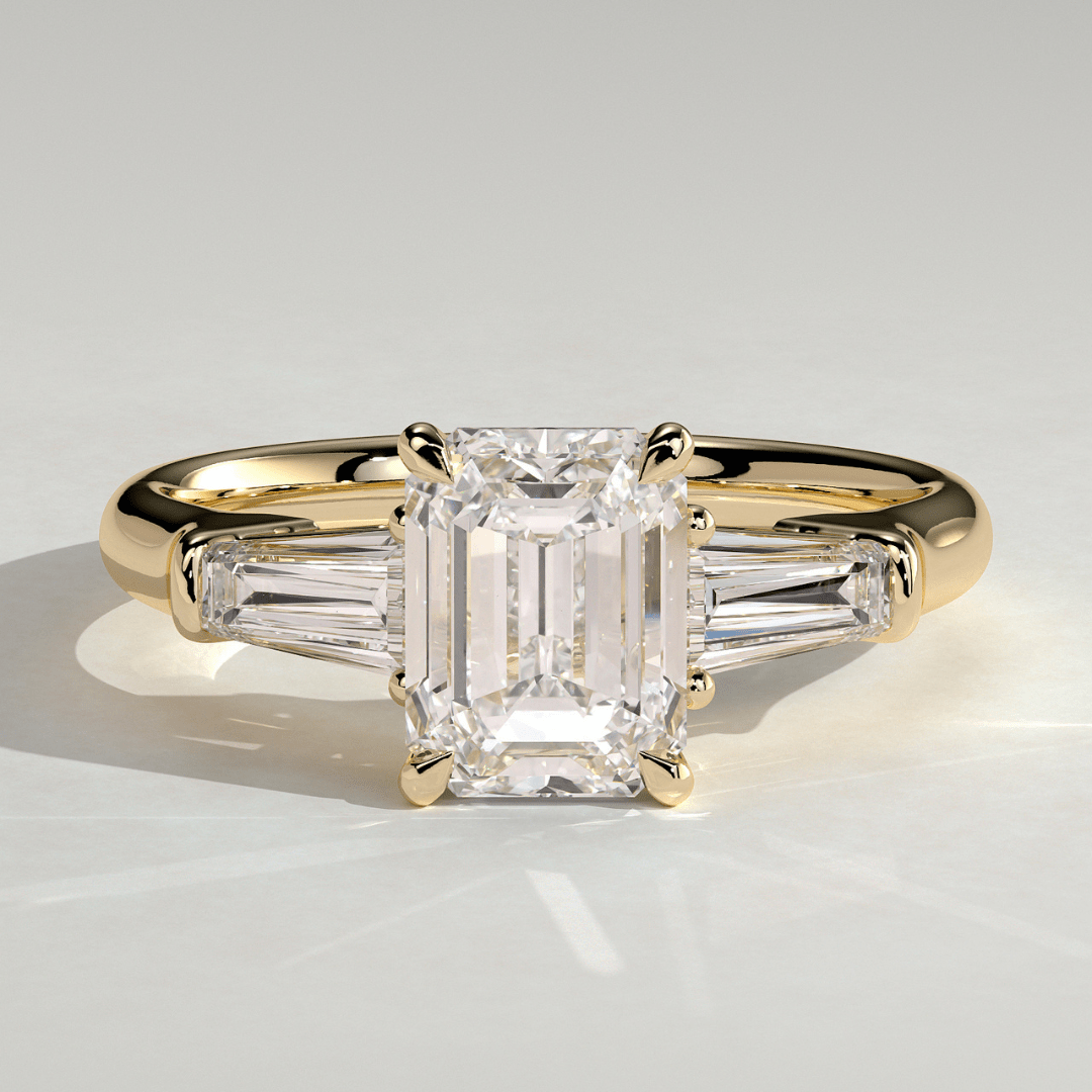 3 CT Emerald Cut Moissanite 4 Claw Trilogy with Tapered Baguette Side Stones Engagement Ring - Kazara Diam