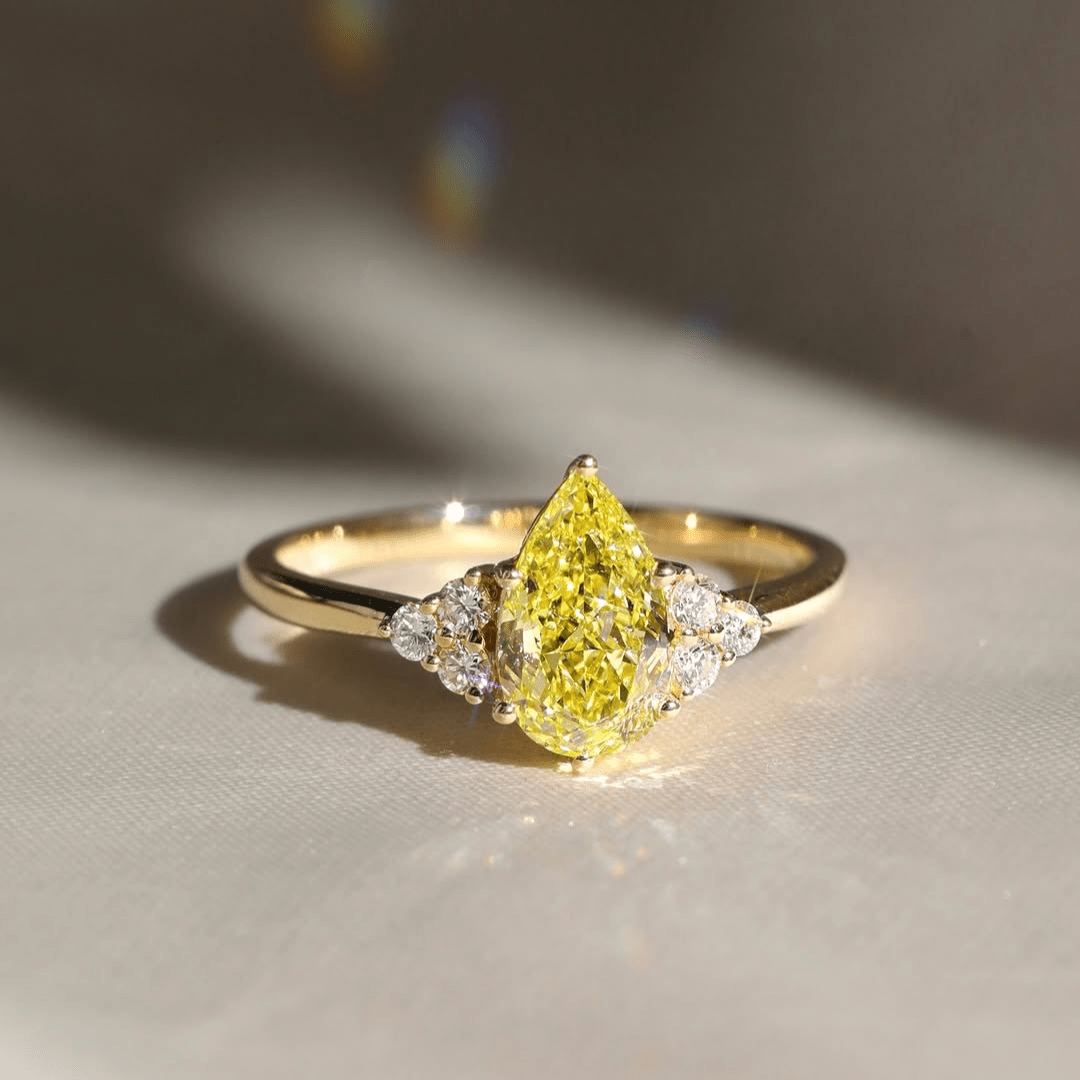 3.0CT Pear Cut Yellow Moissanite Engagement Ring with White Side Stones - Kazara Diam