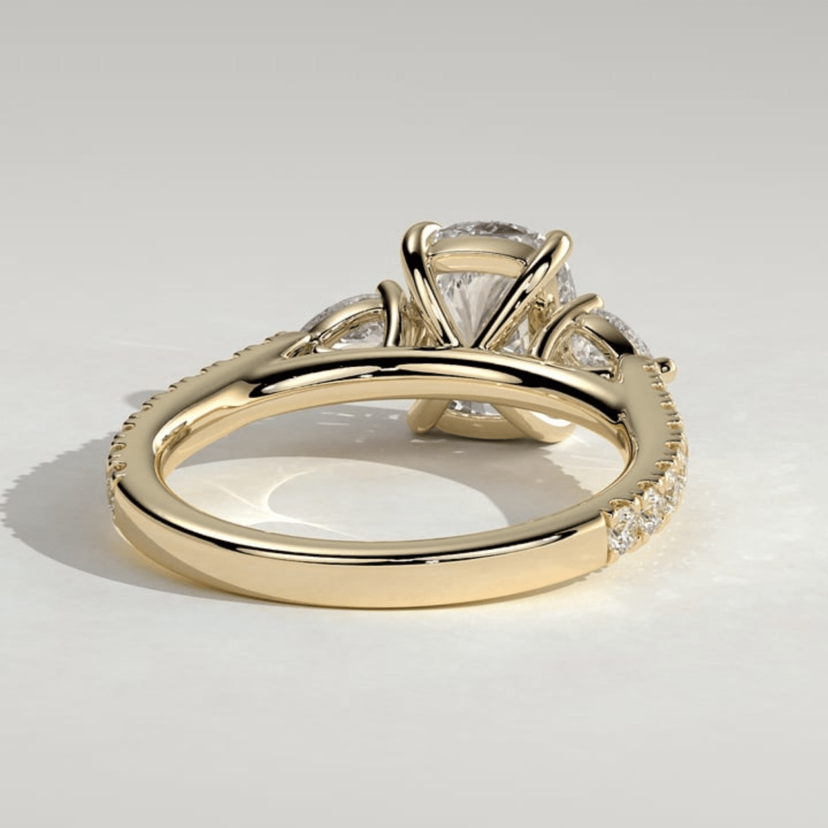 3CT Elongated Cushion 4-Claw Trilogy Moissanite Engagement Ring with Pear Side Stones & Pavé Band - Kazara Diam
