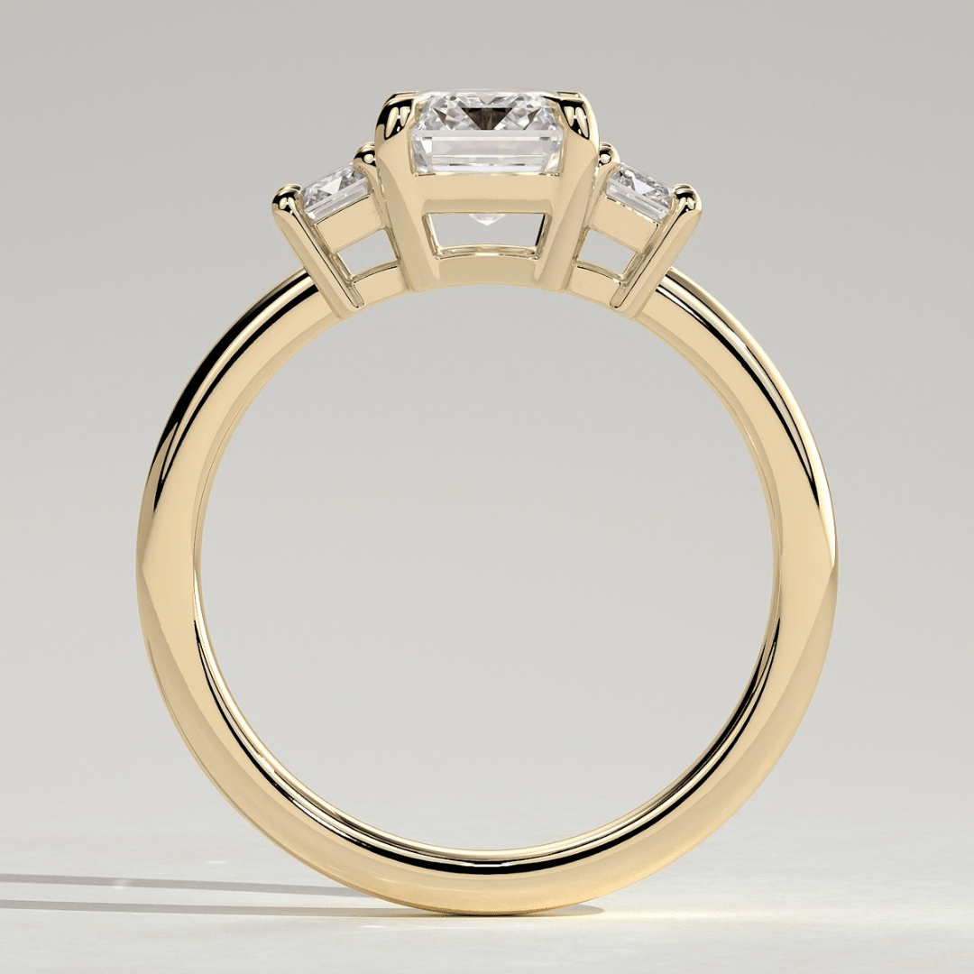4CT Emerald 4 Claw Trilogy Engagement Ring with Emerald Side Stones - Kazara Diam